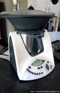 A Thermomix machine fitted with the steaming attachment