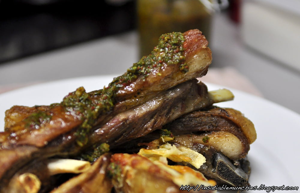 Lamb ribs are first boiled in a stock, then roasted to a crisp perfection, before being served with a tangy basil chimmichurri.