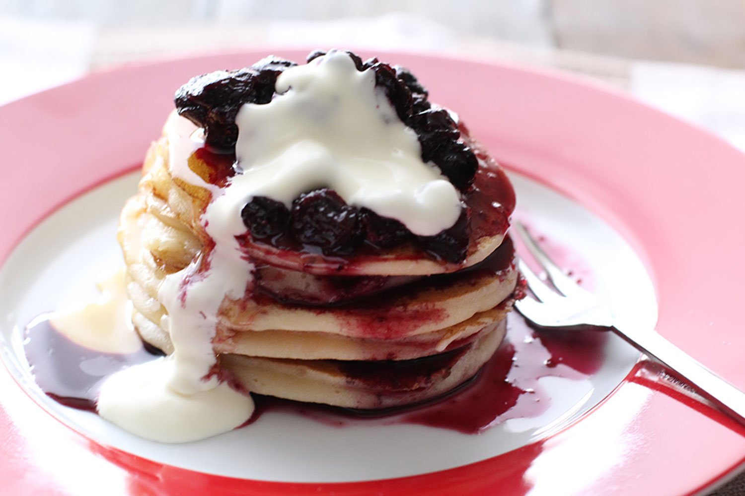 Recipe for fluffy ricotta pancakes, fresh blueberry compote, and decadent chantilly cream