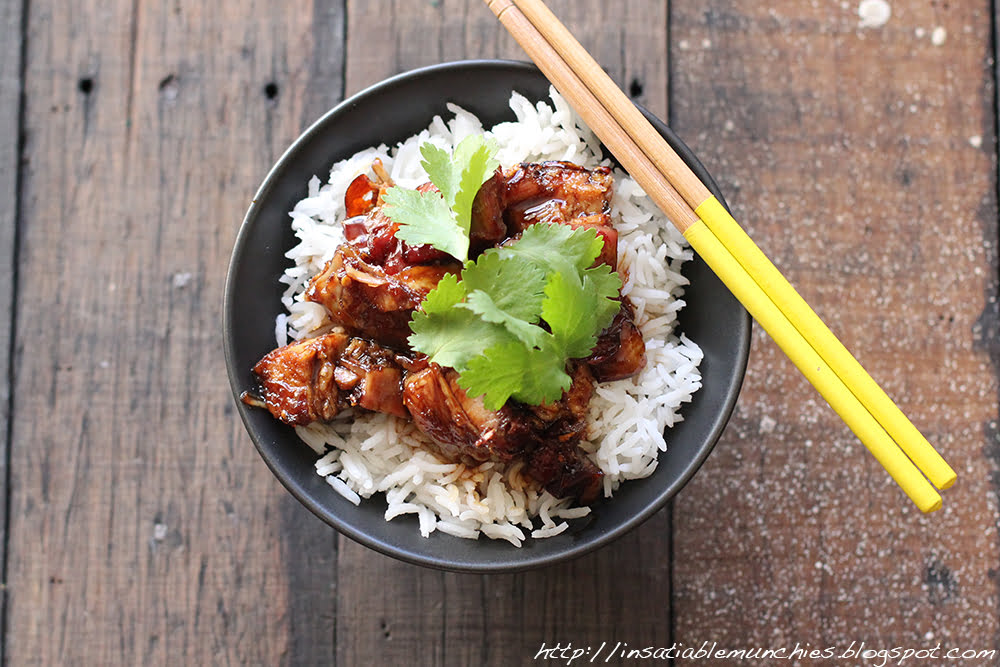 Tender, slow roasted pork belly is braised in a soy based sauce, and served on rice, garnished with coriander.