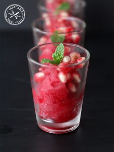 Blood orange sorbet, scooped into shot glasses, loaded with pomegranate and baby mint leaves