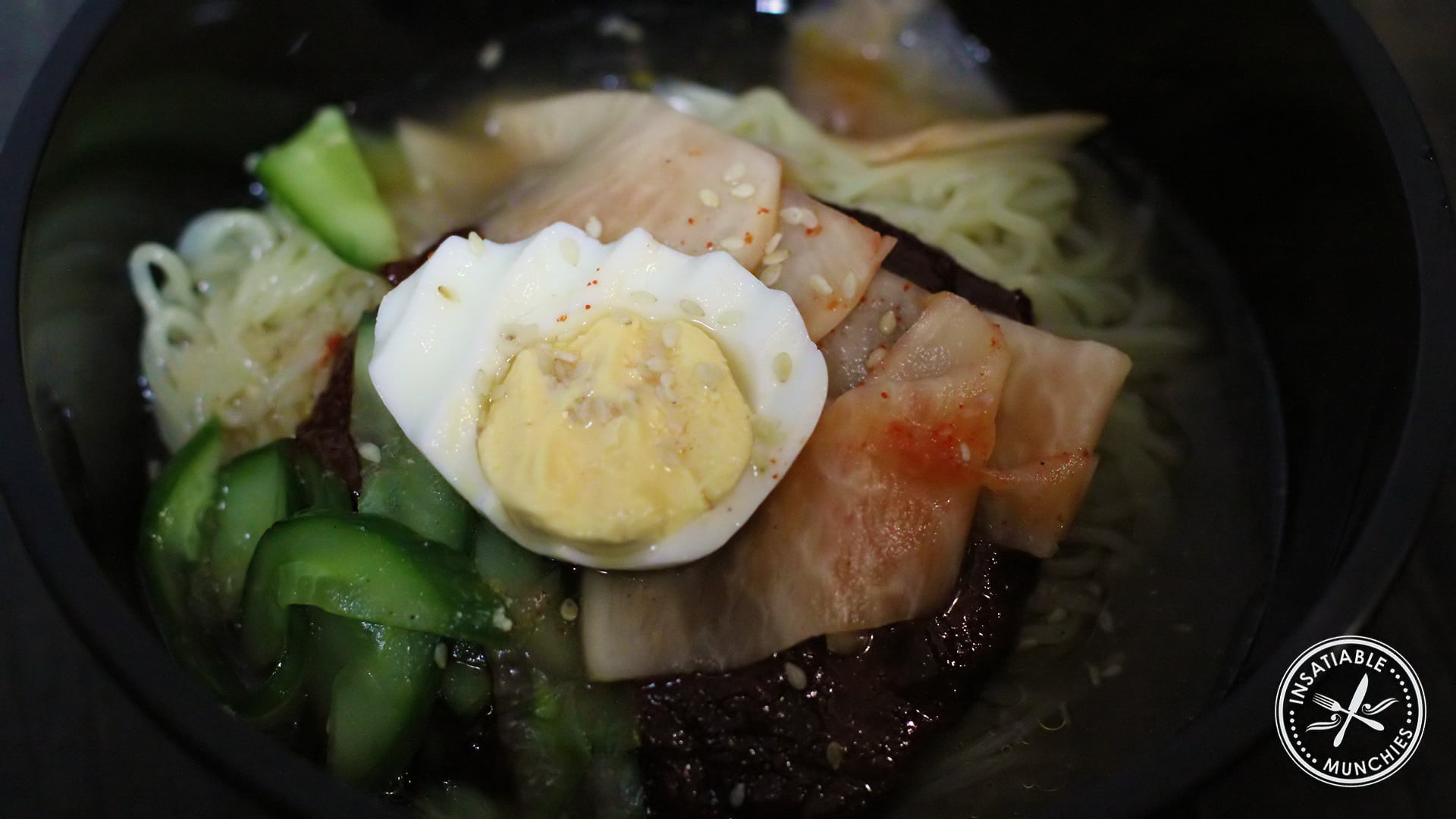 Bibim Naeng Myeong: Chewy korean noodles served cold, with a chilli sauce and radish pickles.