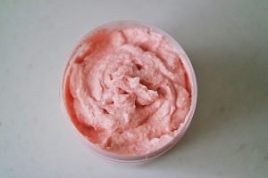 A tub of bright pink taramasalata, a salted cod roe dip full creamy with garlic and lemon.
