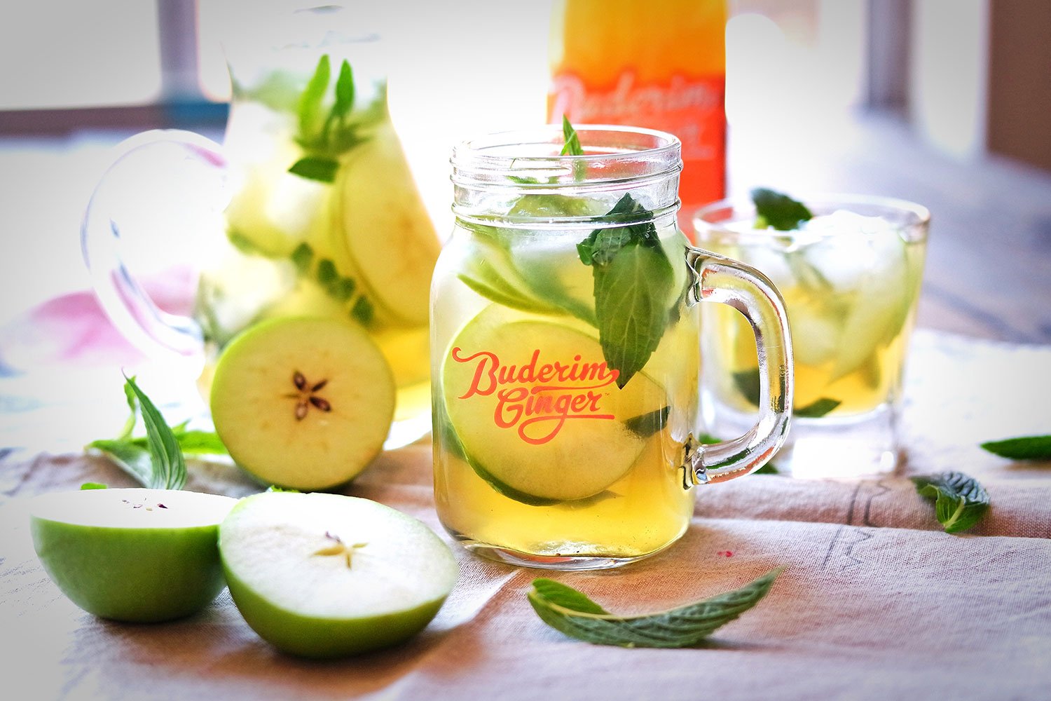 Refreshing Apple Green Tea and Ginger iced tea, garnished with mint
